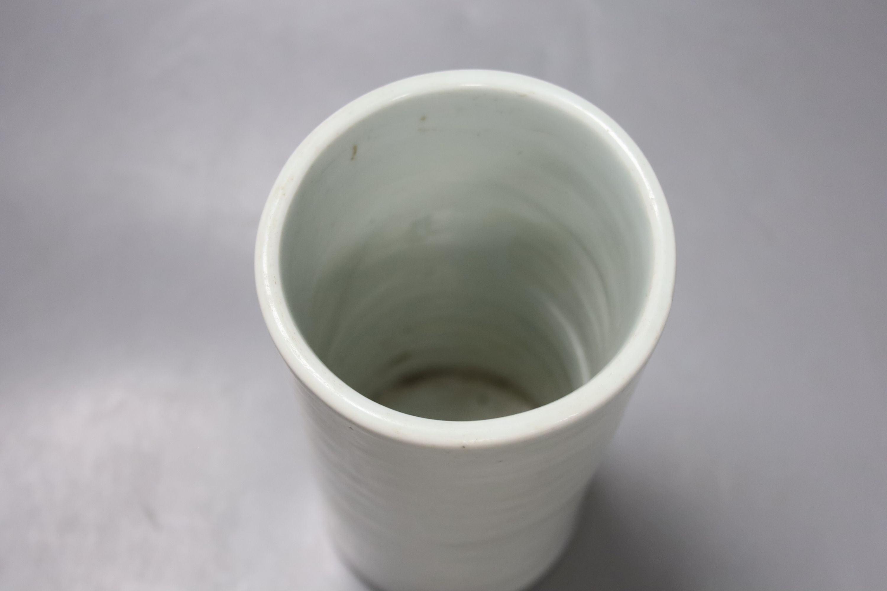 A Chinese white glazed brushpot, height 18cm